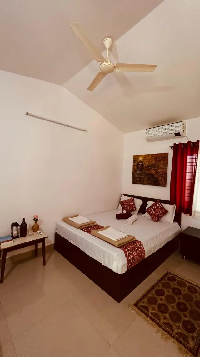 Deluxe AC Cottage — the room under its sloping ceiling