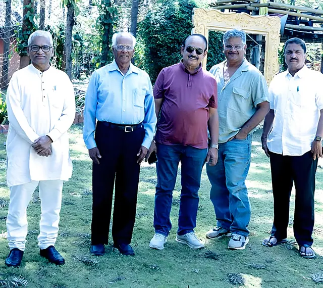 Prof. Ravi Varma Kumar, Arkesh and Y. Mahesh Kumar with founder Prithvi Mallanna and another guest on the lawn at Saakshi Retreat