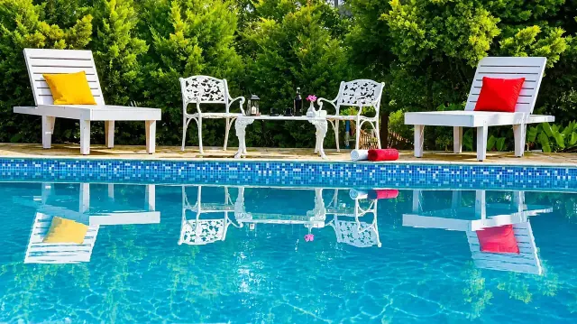 Swimming pool with loungers