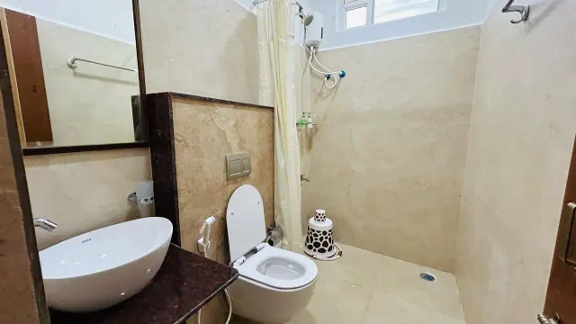 Premium AC Cottage — attached bathroom with shower