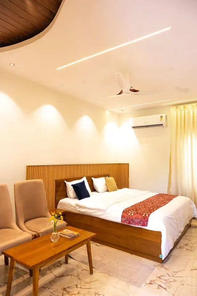 Premium AC Cottage — the room under its curved wooden ceiling