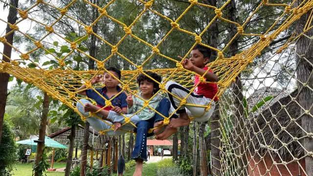 Children playing on rope nets