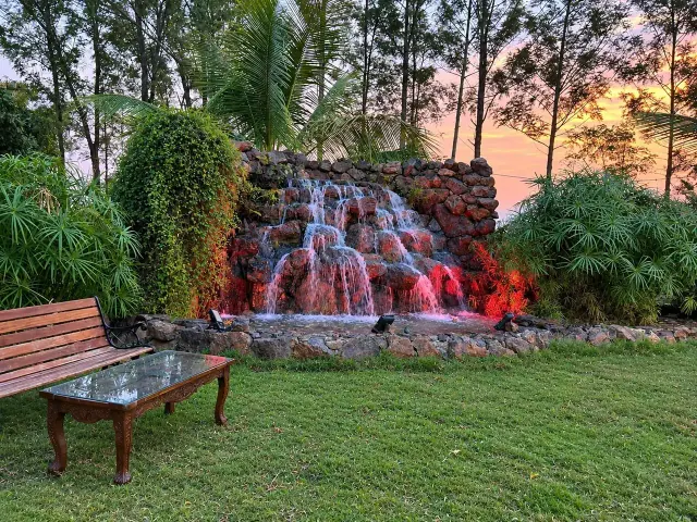 Rock waterfall lit at dusk